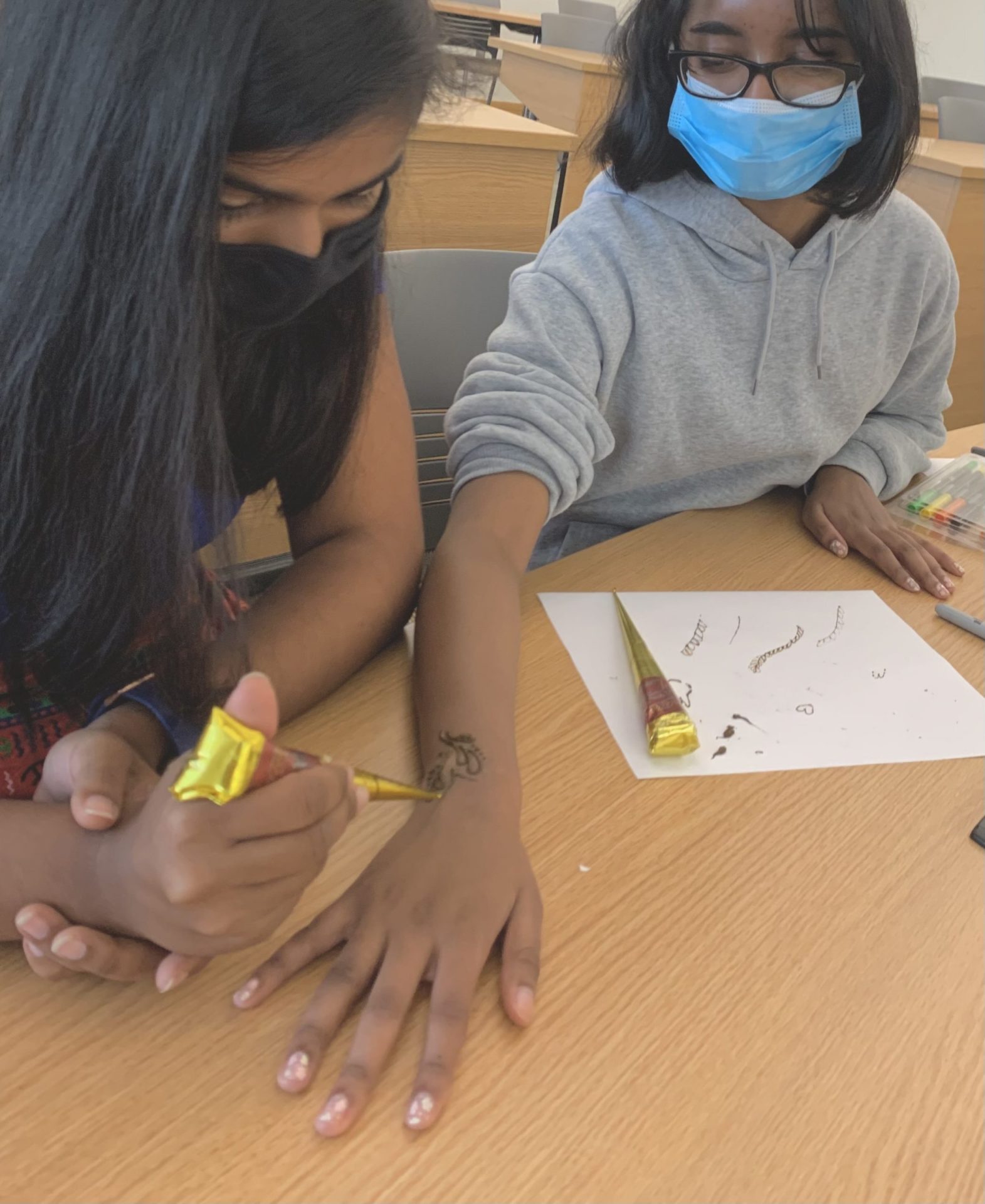 ACA's Henna night where Mita is pictured on the right and Aarushi Gupta (e-board member) is on the left.