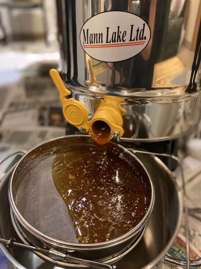 Close up of the electric honey extractor machine.