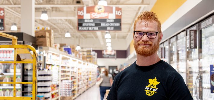 Jeramie stands inside a local ShopRite as part of the research he worked on in his program.