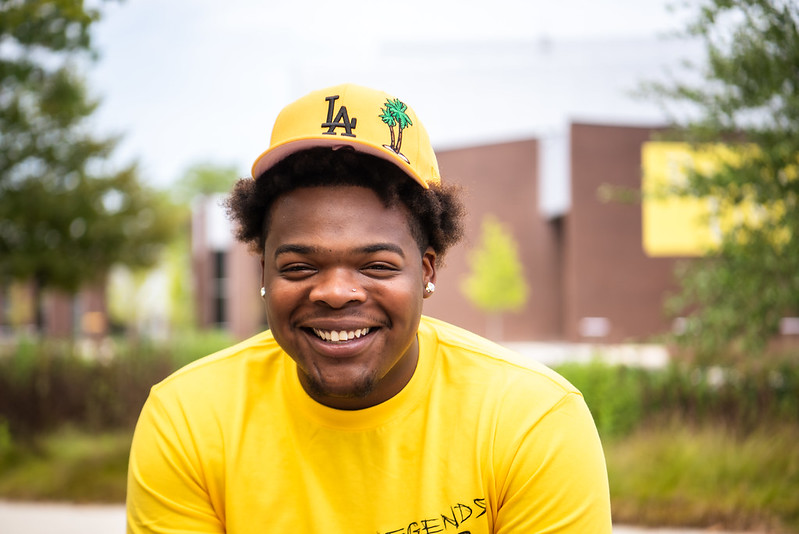 Pharoah smiles in front of Wilson Hall.