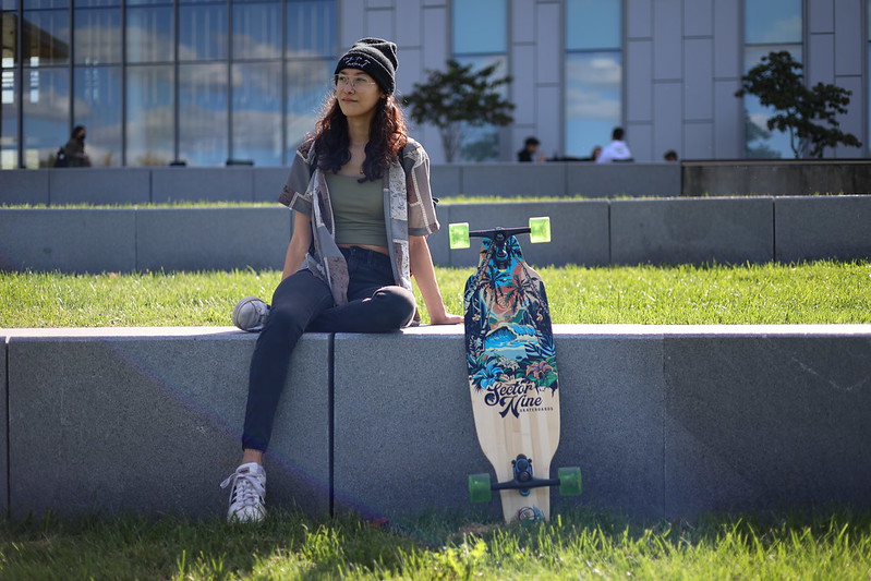 Maria sits outside Business Hall.