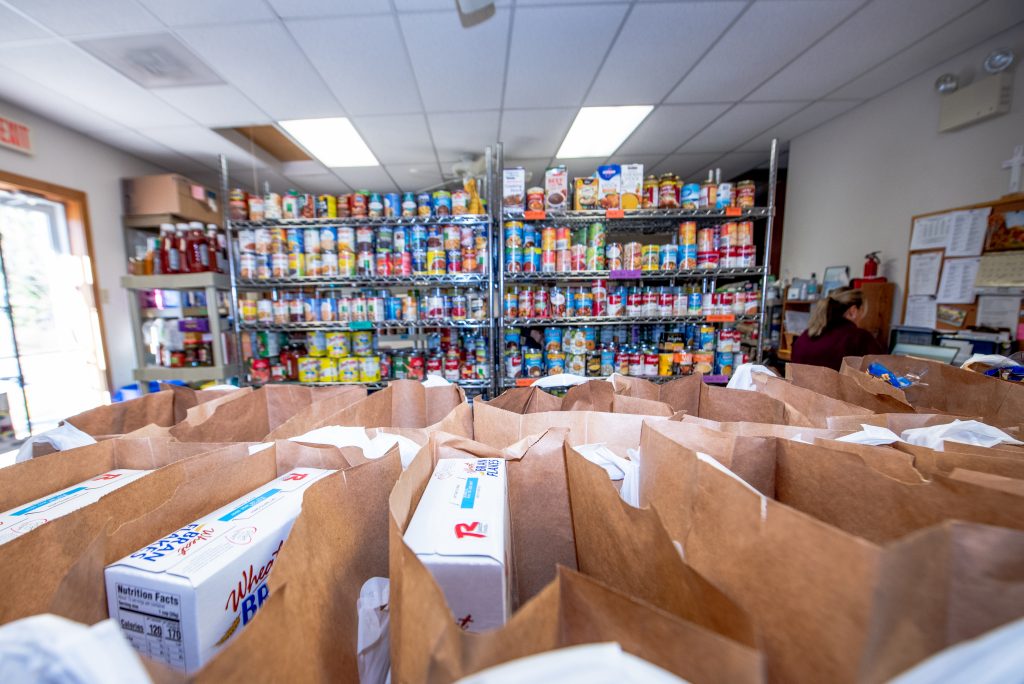 Inside the Glassboro Food Bank, shelves stocked with cans and bags stuffed with food