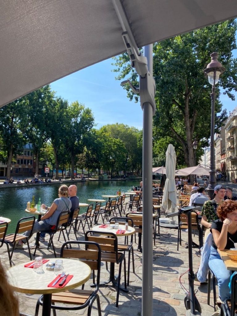 Picture Calysta took of people sitting outside of a Cafe facing the Seine, a 777-kilometre-long river that flows through northern France.