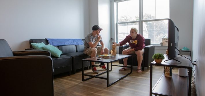 Roommates hang out in their 57 North Main apartment.