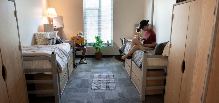 Two first year students hang out in their dorm.