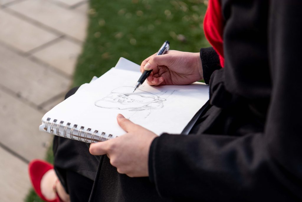 Terry sketches at the Wilson Hall amphitheater. 