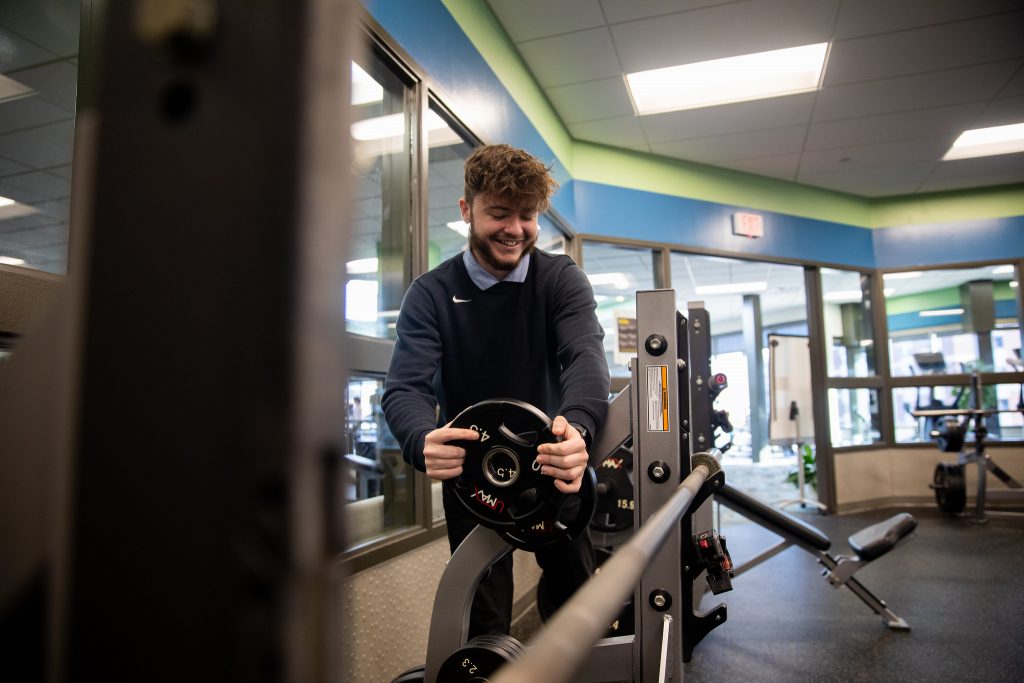 Stevie fixing a weight at the bench