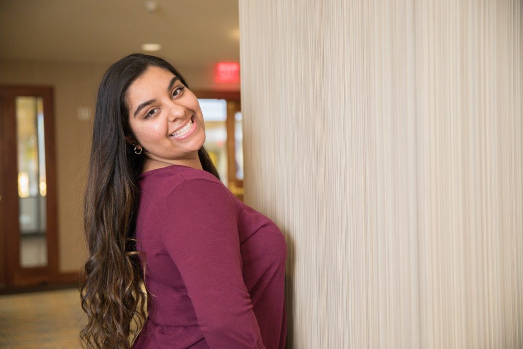 Riya Bhatt smiling inside the Student Center.