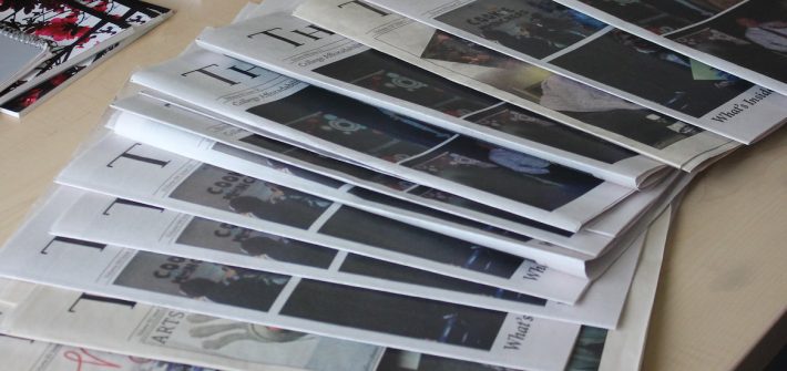 Fanned out print issues of The Whit student newspaper.