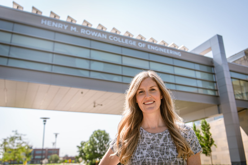 Jennifer stands in front of the Engineering Bridge.