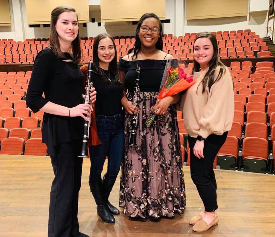 Lia Boncoeur (second from far right) with Rowan University studio members Liz Cicali (far left), Veronica Menna (second from left) and Lisa Harkisheimer (far right) after a concert performance with the Rowan University Orchestra.