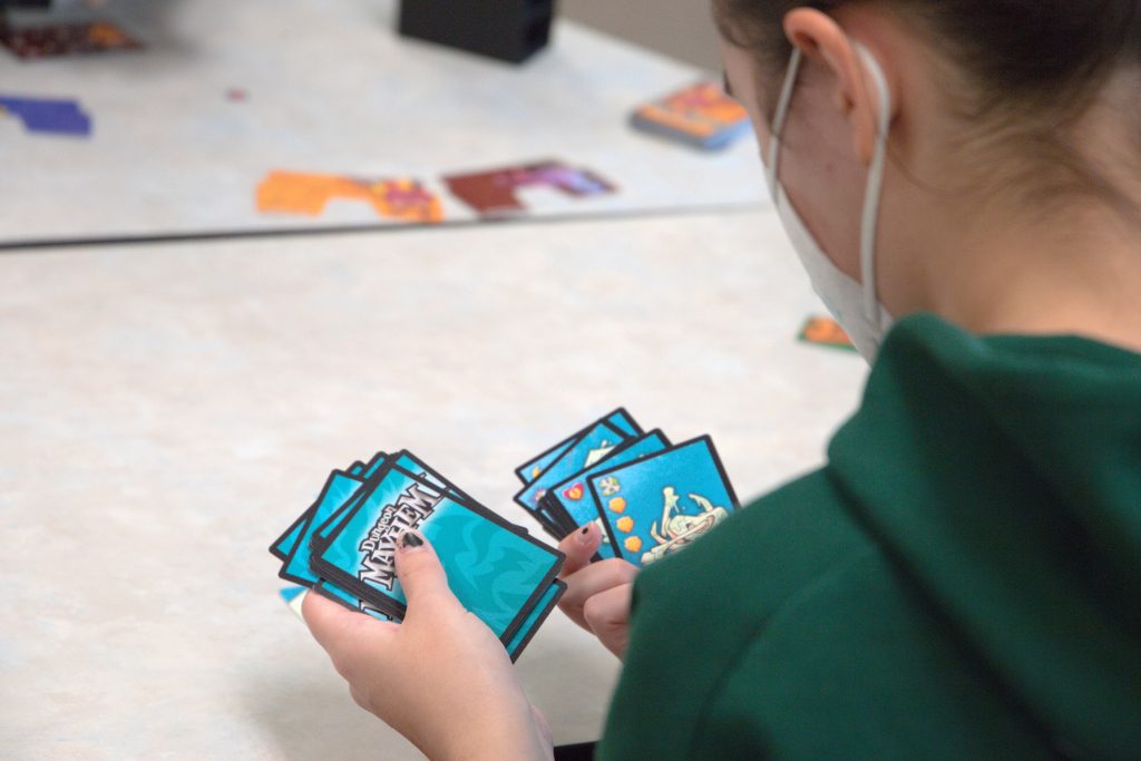 Closeup of card game played at OSTEM member meeting.