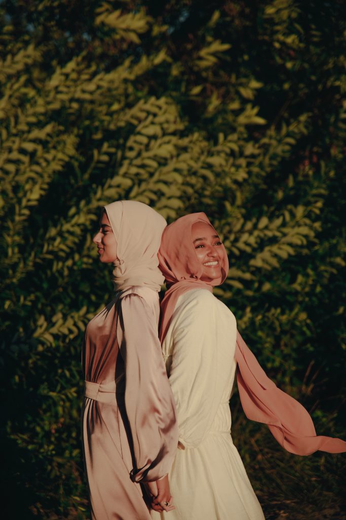 Two women wearing the Kaftan and hijab.