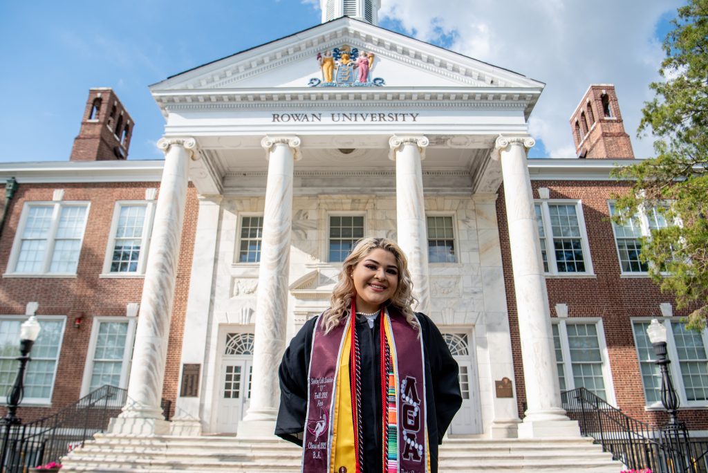 Shirley poses outside of Bunce Hall.