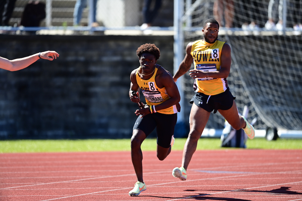 Teammates hand off the baton.