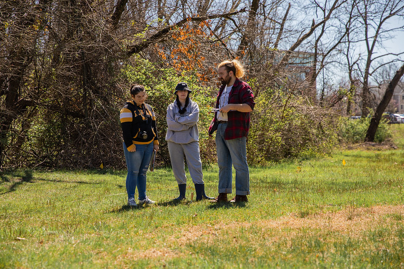 Dawson Kipphut (right) directing fellow classmates at the mock forensic dig investigation.