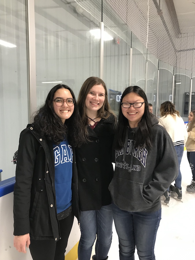 Danielly with friends at an ice skating rink.