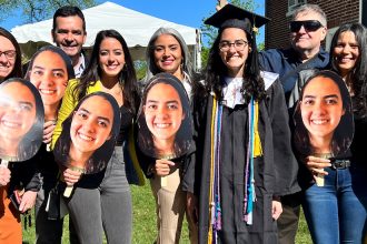Danielly celebrates commencement with her family.