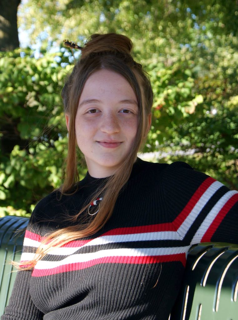 Morgan Van Holtz sitting on a bench.