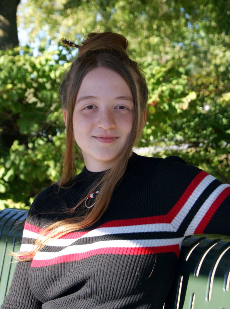 Morgan Van Holtz sitting on a bench. 