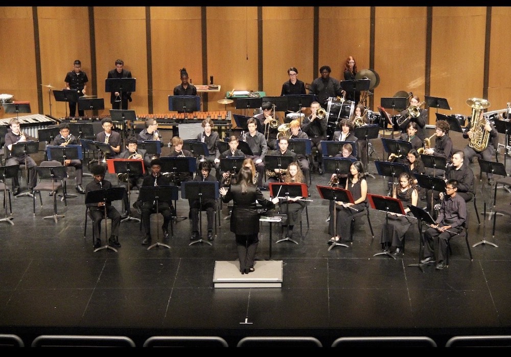 Carly conducts Washington Township orchestra.