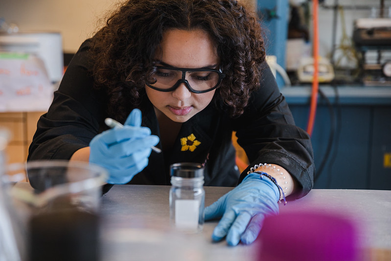 Biological Sciences major Aryana M. tests an experiment in the lab.