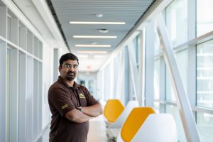 Amit posing for a portrait in engineering hall.
