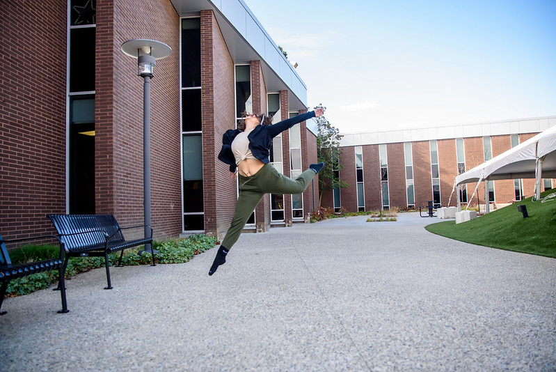 Senior Dance major Sabrina V. leaps outside of Wilson Hall.