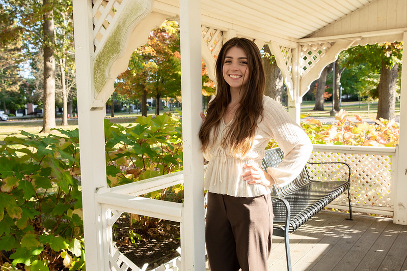 Rowan University Supply Chain and Logistics major Alivia stands proudly in a gazebo.