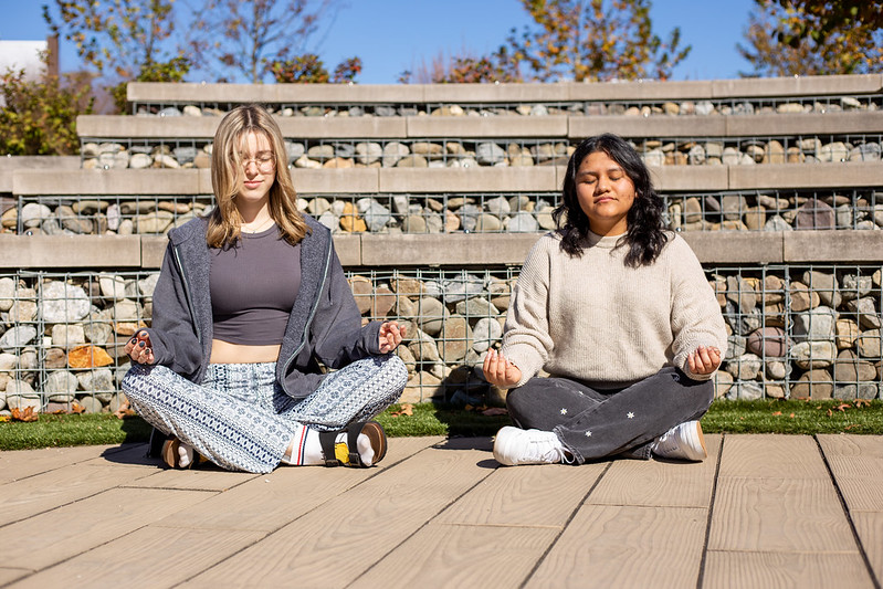 Rowan University HCI contributor Alexa meditates with a friend.