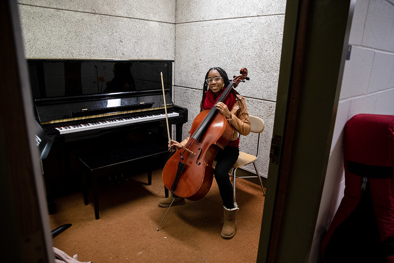 Aaliyah playing cello in one of Wilson Hall's practice rooms.