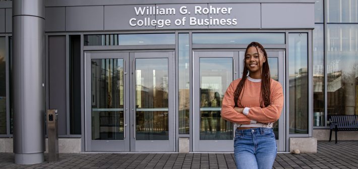 Lanasia stands outside the Rohrer College of Business building.