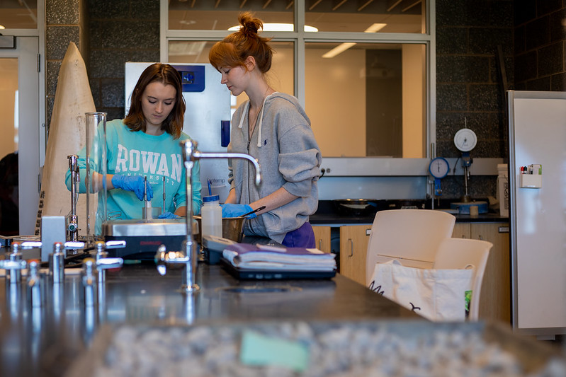 Civil engineering major Kayla (left) and another student work on a project in the concrete lab in Engineering Hall.
