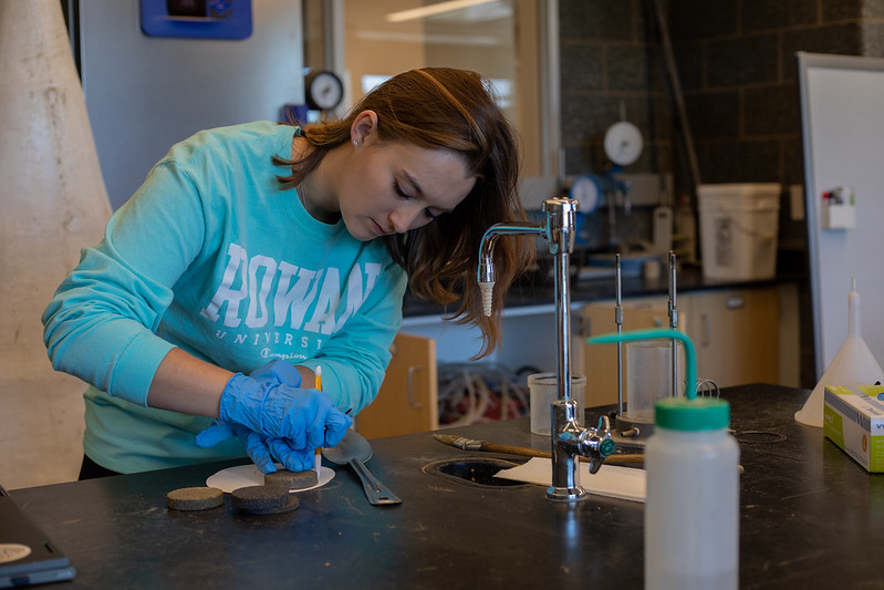 Rowan University Civil Engineering major Kayla works on a project inside the concrete lab in Engineering Hall.