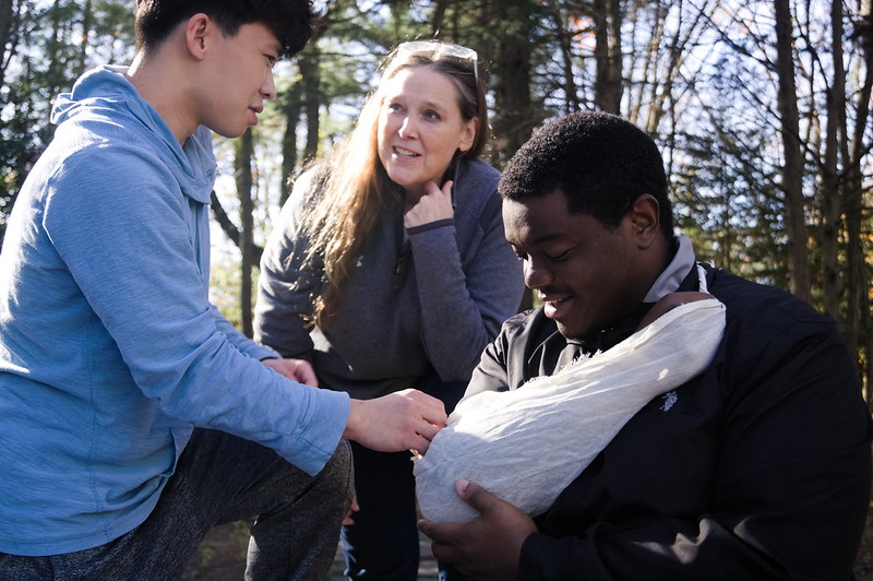Dr. Shari Willis works with students during an outdoor scenario. 