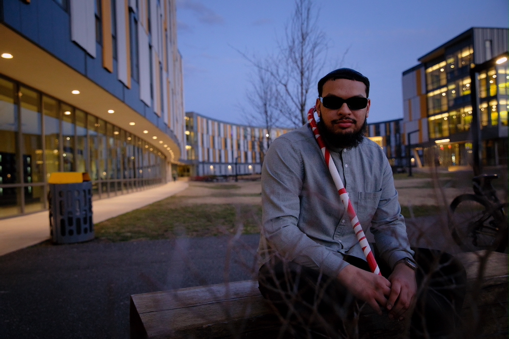 Biological Sciences major Fadi Khan sits outside Holly Pointe Commons.