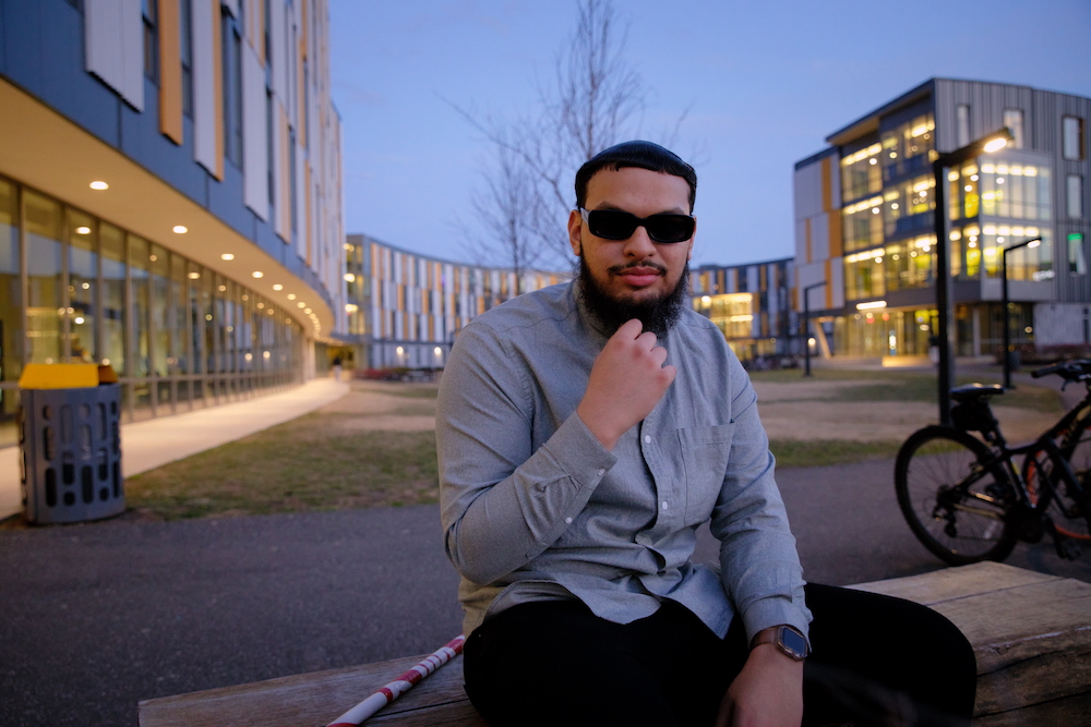 Biological Sciences major Fadi Khan sits outside Holly Pointe Commons.