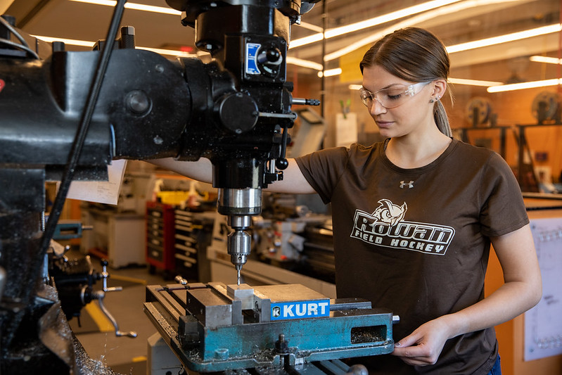Abby Hainesworth utilizing equipment in mechanical engineering lab. 