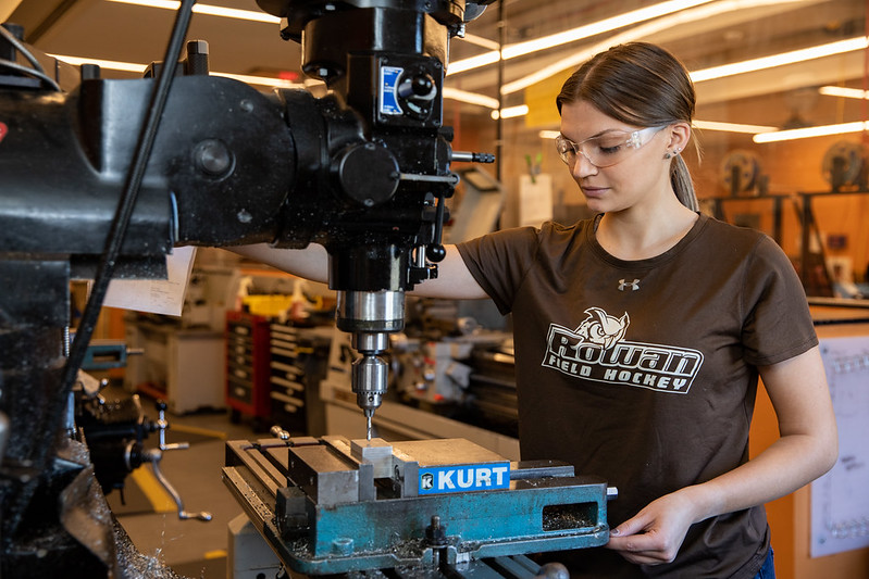Abby Hainesworth utilizing equipment in mechanical engineering lab.