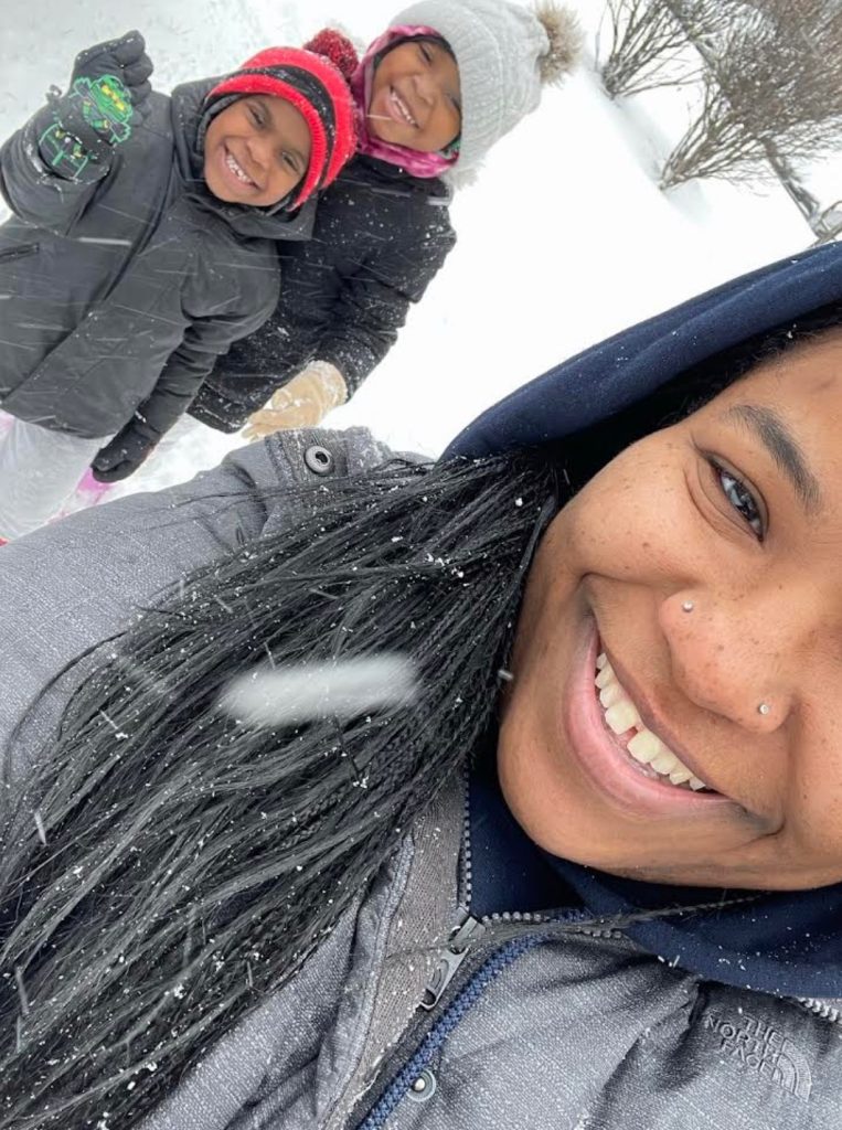 Charmaine Harris and her children in the snow