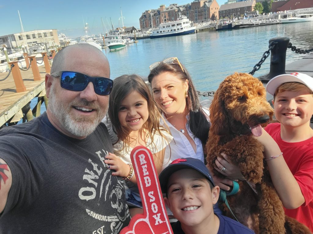 Lea DeLuca with her family on a dock.