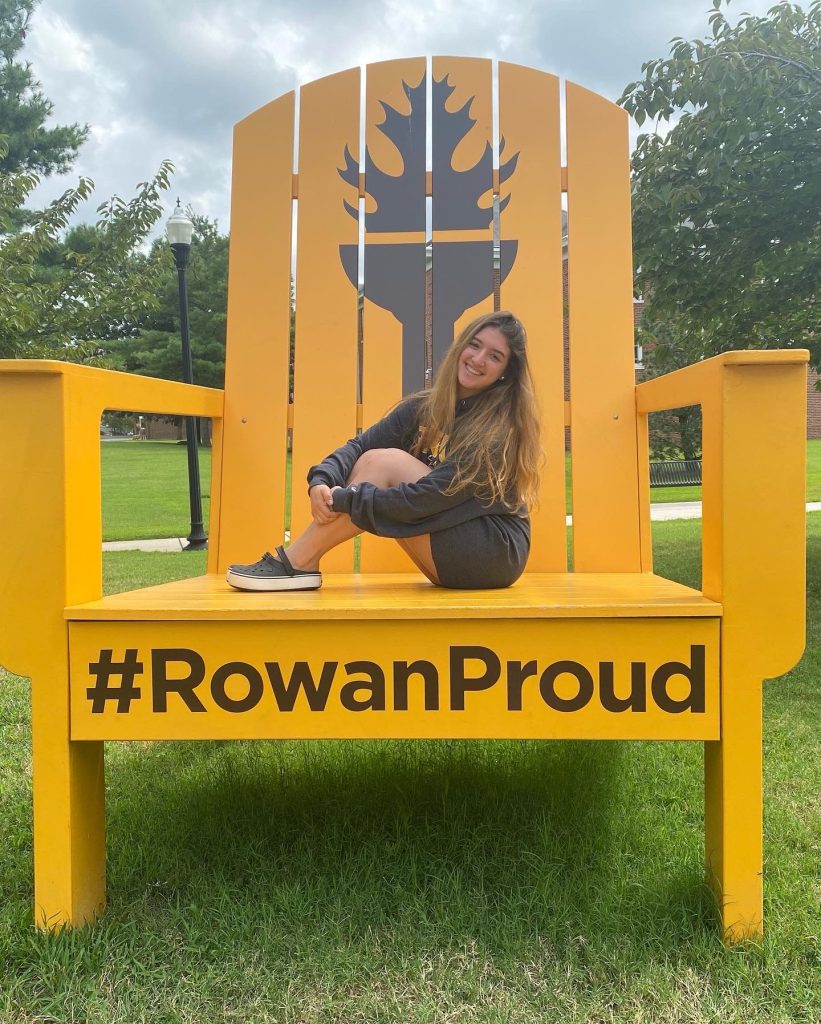 Valentina sits in an oversized #RowanPROUD chair that stands 10 feet tall. 
