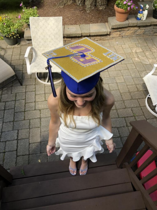 Meghan Tynan, during her high school graduation with her decorated
cap for Rowan.