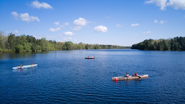 A big picture view of three concrete canoes in the water. 