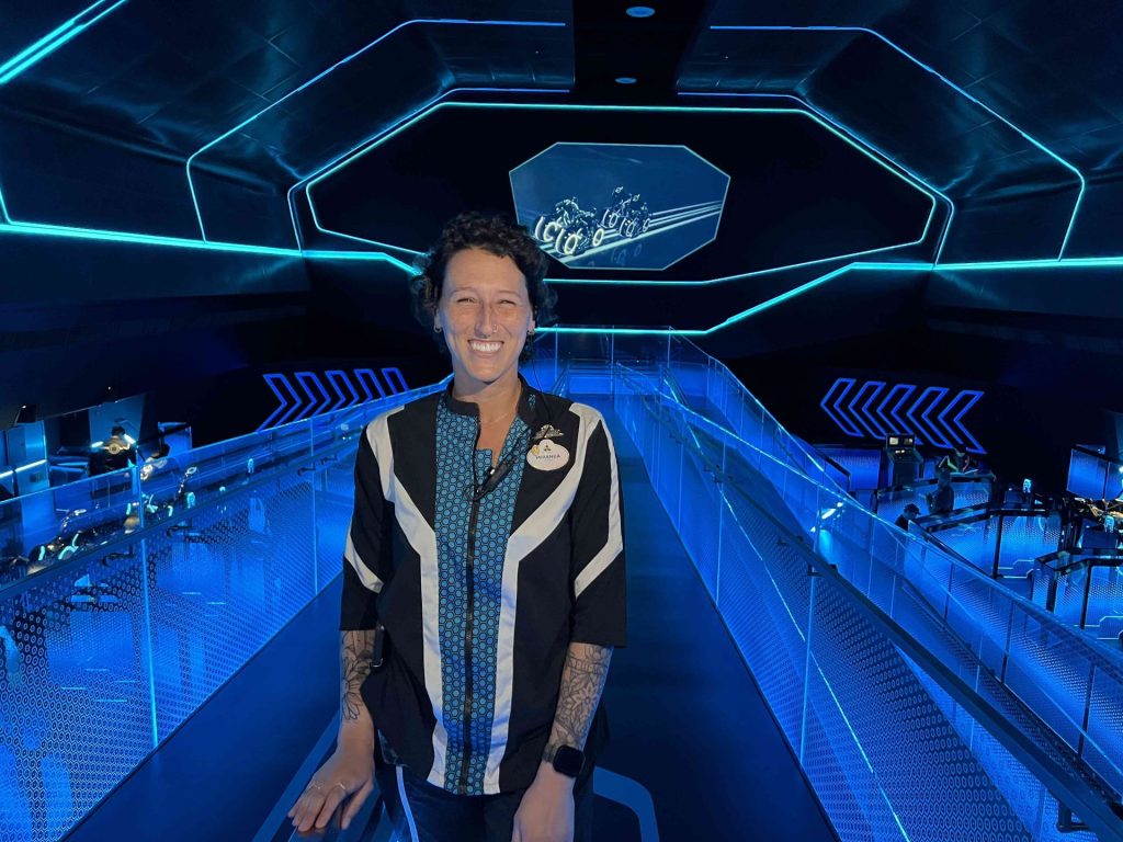 Miranda inside of Tron, the ride she manages.
