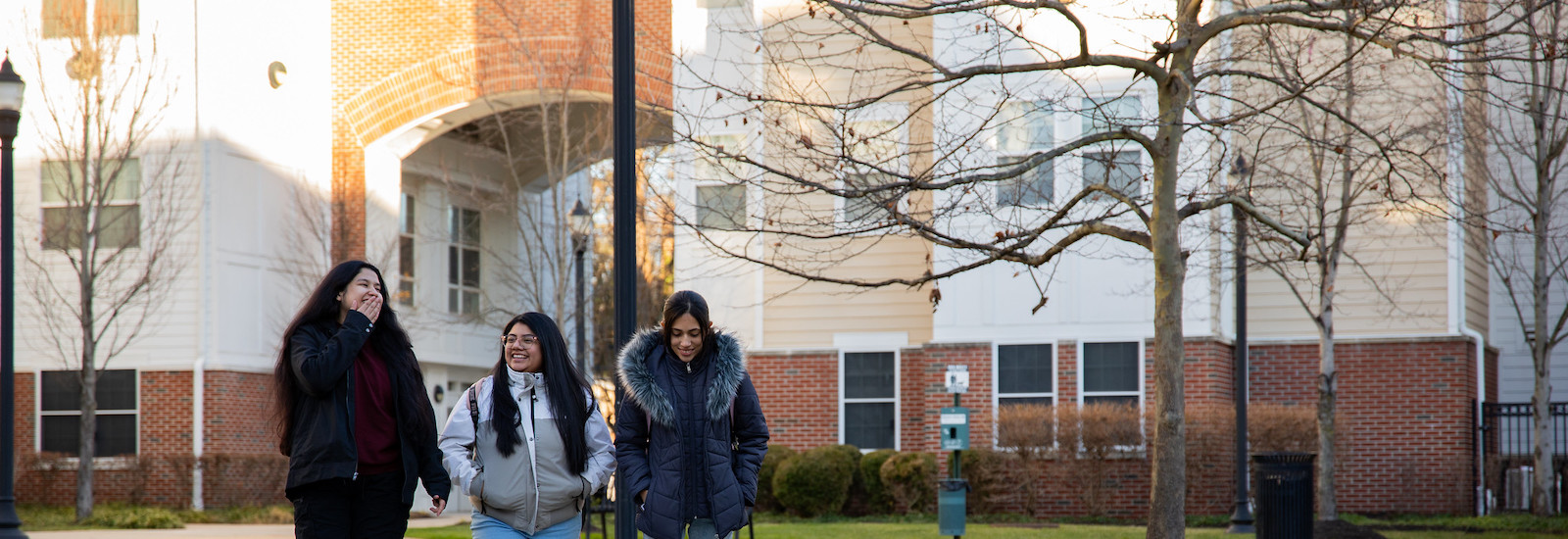 Rosa walks with two friends through campus.